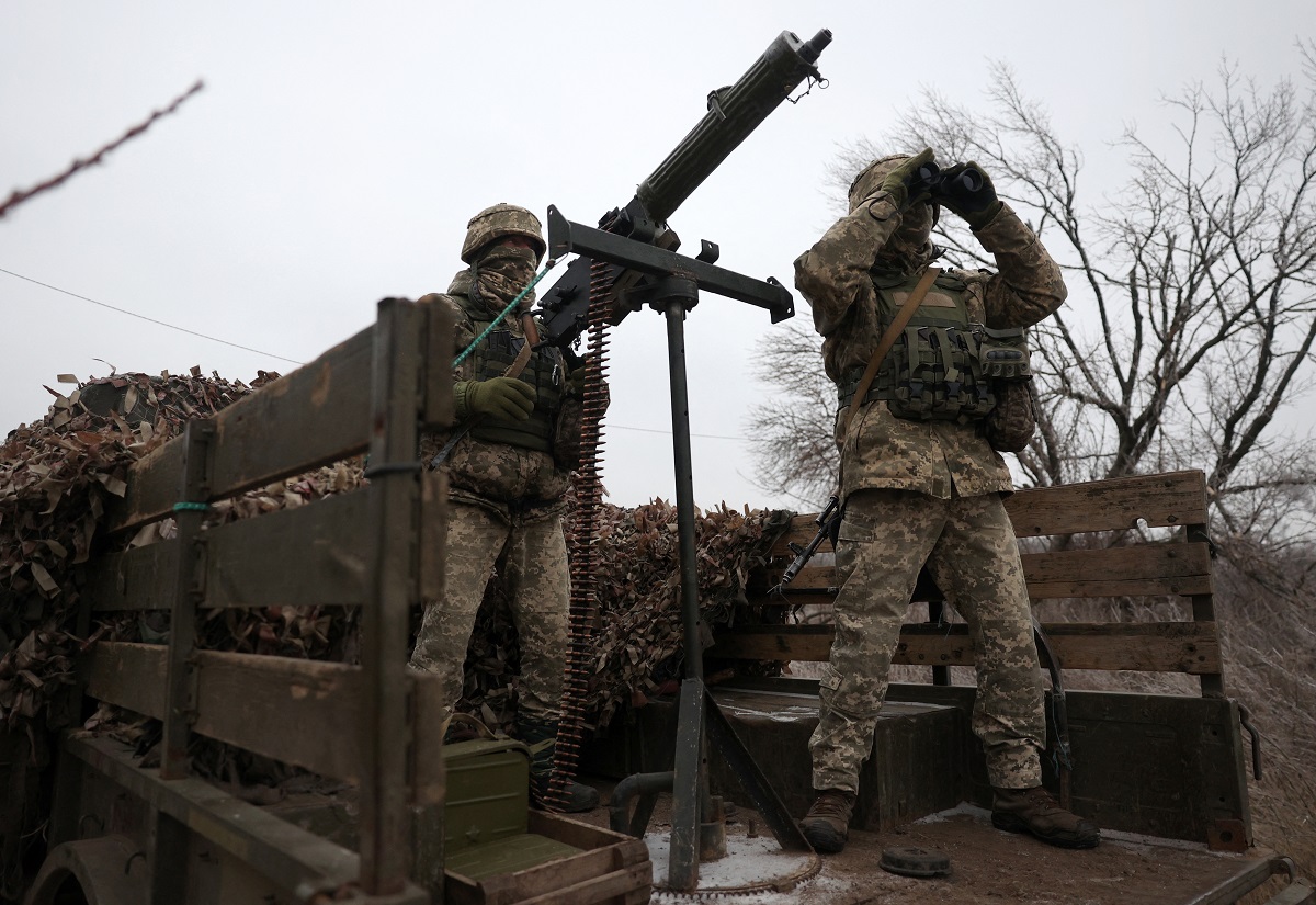 ukrainian soldiers monitor the sky at their position in the donetsk region