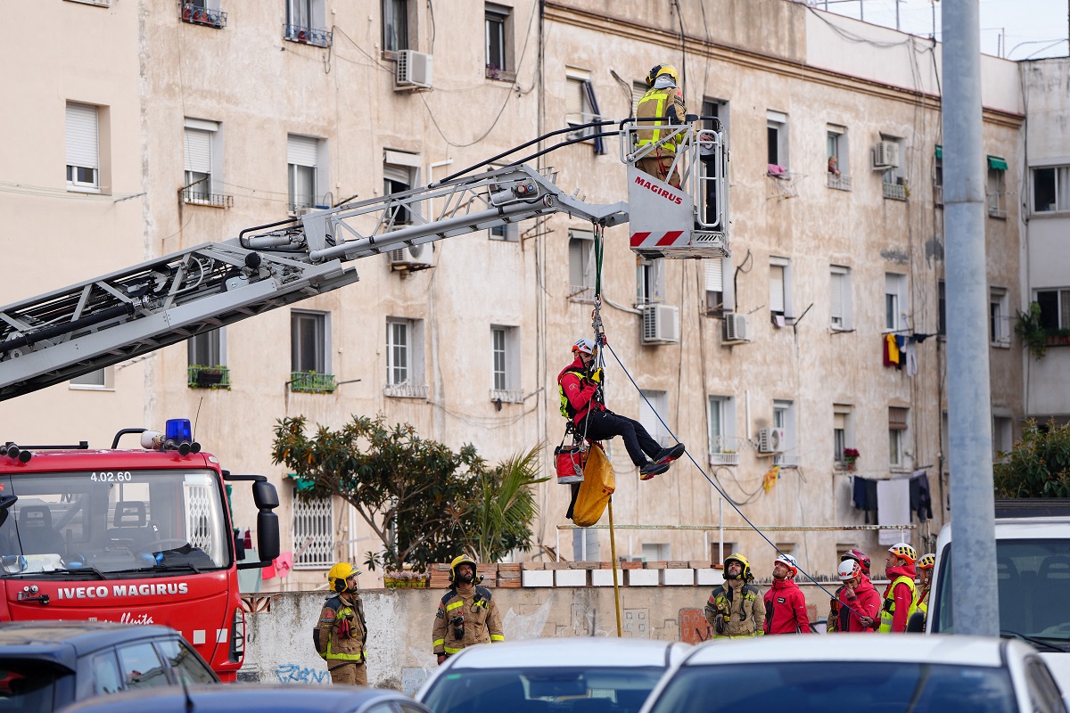 spain bandalona firefighters inspect building from a ladder